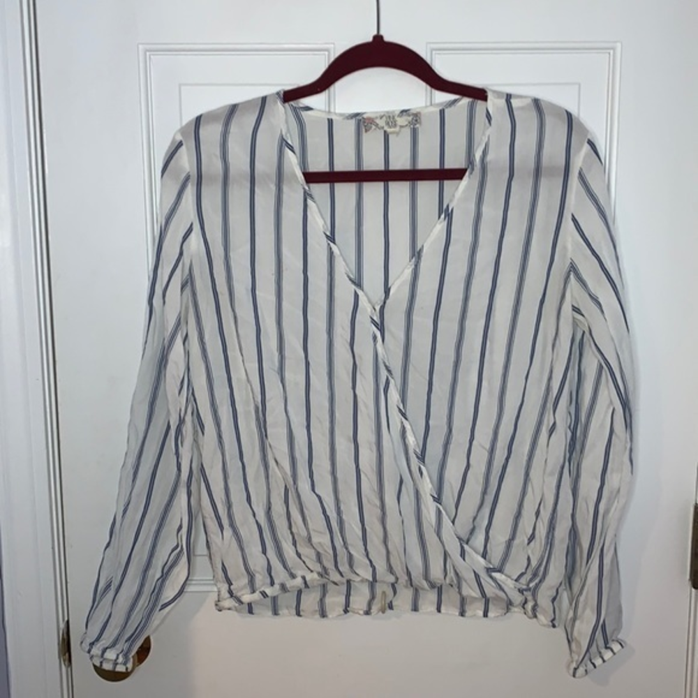White and blue blouse wrap in the front